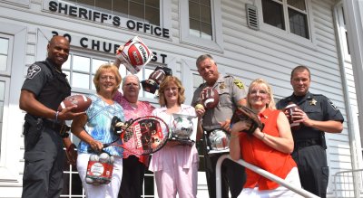 Pictured above: Sheriff Mike Evans, Major Dave McDowell, DFC Andre Mitchell, Kathy Baker, Carol Benke, Susan Ude and Jo Ann Martin.