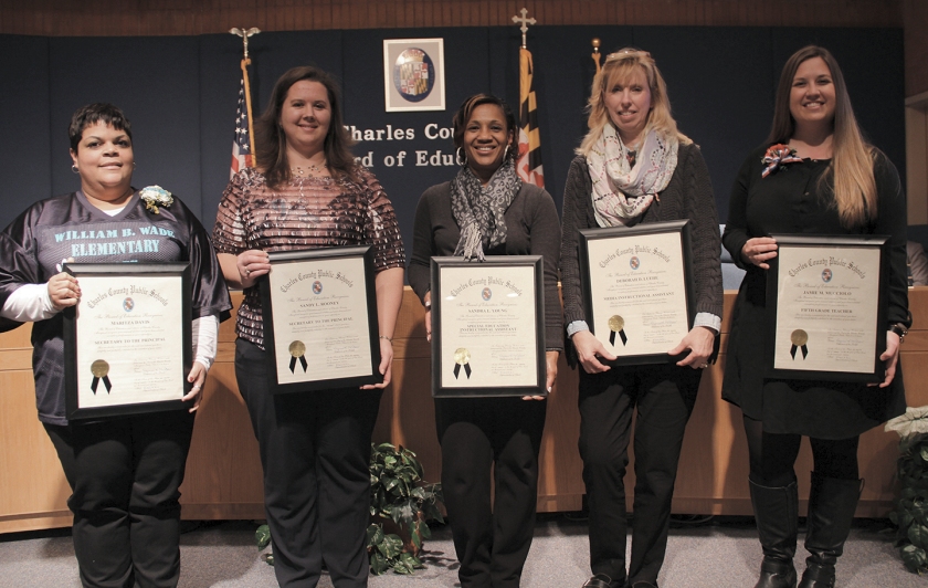 The Board of Education Jan. 12 honored five Charles County Public Schools employees for their commitment to teaching and learning and their dedication to the school system. Honored, from left, were: Maritza Davis, secretary to the principal, William B. Wade Elementary School; Sandy Rooney, secretary to the principal, Robert D. Stethem Educational Center; Sandra Young, special education instructional assistant, Dr. Samuel A. Mudd Elementary School; Deborah Luehe, media instructional assistant, Matthew Henson Middle School; and Jamie Mucciolo, fifth-grade teacher, Daniel of St. Thomas Jenifer Elementary School.