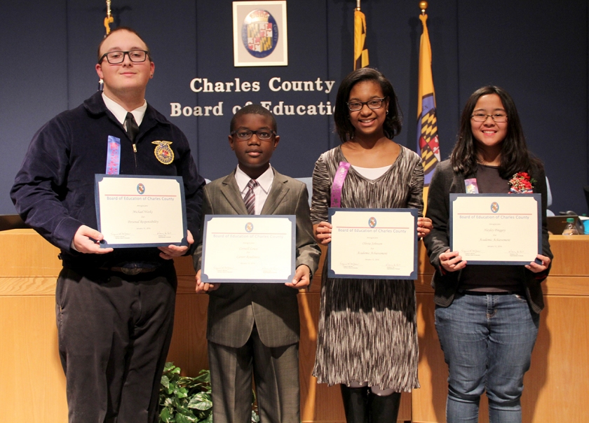 The Board of Education Jan. 12 honored four Charles County Public Schools students for their accomplishments in academic achievement, personal responsibility and career readiness. Honored, from left, were: Michael Weeks, senior, Robert D. Stethem Educational Center; Cornell Lowe, fifth grader, William B. Wade Elementary School; Olivia Johnson, eighth grader, Matthew Henson Middle School; and Hayley Pinggoy, fifth grader, Daniel of St. Thomas Jenifer Elementary School.