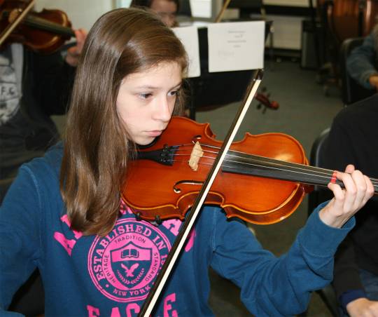 Serenah Illick, an eighth grader at Milton M. Somers Middle School, concentrates on playing "Gauntlet" during Tri-County Orchestra rehearsals held in early January.