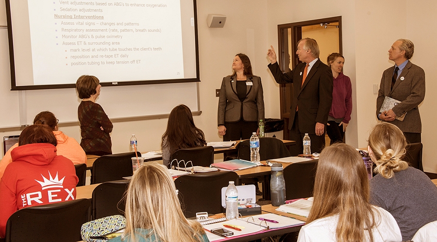 Maryland Comptroller Peter Franchot, center, points to a PowerPoint slide in Professor Kathleen Parsons&rsquo; NUR-2115 Nursing Care of Adults class and tells students that healthcare is where the growth of jobs will be for the next 10 years. (Photo: CSM)