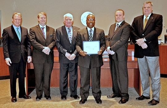 Dr. Tracy Harris, third from right, with the commissioners of St. Mary's County. (Photo provided by St. Mary's County Government).