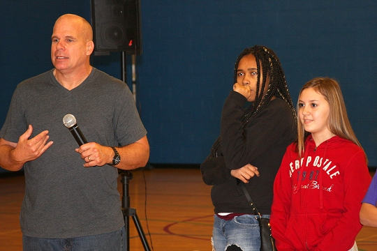 Keith Deltano works with Milton M. Somers Middle School students DJa'Quan Thomas and Ashley Proctor to demonstrate how to stop bullying.