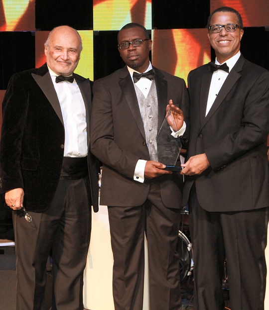 Ernest Yelder&mdash;a Naval Surface Warfare Center Dahlgren Division cybersecurity expert based at Combat Direction Systems Activity (CDSA) Dam Neck&mdash;accepts his 2016 Black Engineer of the Year Award from Dr. Ken Washington, Ford Motor Company Vice President of Research and Advanced Engineering, during the 30th annual Black Engineer of the Year Awards (BEYA) Gala in Philadelphia, Feb. 20. The three-day BEYA conference recognized the significant accomplishments of African-Americans in government and industry, who have achieved exceptional career gains in the fields of science, technology, engineering and mathematics. (U.S. Navy photo/Released)