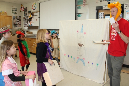 Dr. James Craik Elementary School's Craik Scavenger Girls get last-minute instructions from Dennis Murphy, a timer and announcer, before taking part in the "Get a Clue" challenge during a Destination Imagination tournament held recently at North Point High School. Pictured from left are third graders Ava Ross, Isabelle Madore, Jordyn Tyler, Lainey Mullikan, Ava Rowledge and Emmalyn Fetters.