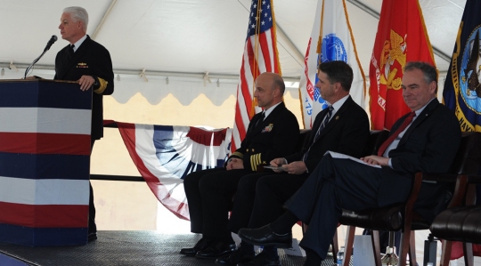 Vice Admiral Terry Benedict, Navy Strategic Systems Programs (SSP) director, tells Naval Surface Warfare Center Dahlgren Division (NSWCDD) personnel that their efforts are "absolutely critical to the defense of our country" during a ground breaking ceremony for the new Missile Support Facility, March 18. "Once completed, this $22.7 million effort, 58,000-square-foot facility is going to house the SLBM (Submarine Launched Ballistic Missile) program offices and the labs for over 300 outstanding professionals in the fields of engineering, physics, math, statistics, computer science, and the list goes on," said Benedict, the event's keynote speaker, as (left to right) NSWCDD Commanding Officer Capt. Brian Durant, Rep. Rob Wittman, R-Va., and Sen. Tim Kaine, D-Va., listen. NSWCDD has been a key member of the SLBM team since the program's inception, and will continue throughout the next generation of submarine - the new Ohio-Replacement Program.