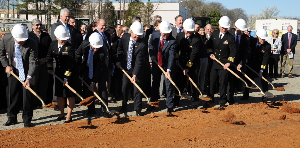 Navy leadership is joined by members of Congress at a groundbreaking ceremony for the new Naval Surface Warfare Center Dahlgren Division (NSWCDD) Missile Support Facility, March 18. The facility will feature state-of-the-art labs, offices, and equipment for more than 300 NSWCDD Strategic and Computing Systems Department scientists, engineers, and technical experts who develop, test, and maintain the Submarine Launched Ballistic Missile (SLBM) fire control and mission planning software. From left to right: Brad Hunley, construction executive for Mortenson Construction; Capt. Mary Feinberg, commanding officer for Naval Support Activity South Potomac; Dennis McLaughlin, NSWCDD technical director; Rep. Rob Wittman, R-Va.; Sen. Tim Kaine, D-Va.; Vice Adm. Terry Benedict, director of Navy Strategic Systems Programs; Capt. Brian Durant, NSWCDD commanding officer; John Fincannon, Senior Executive Service, Strategic Systems Programs; Cmdr. William Windus, Naval Facilities Engineering Command Public Works Officer.