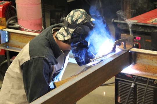 North Point High School junior Blake Flerlage works on a project in Alan Badeaux's welding class. Badeaux's students helped fabricate pieces that are part of the restoration of World War II PT-Boat 305 housed at the National World War II Museum in New Orleans.