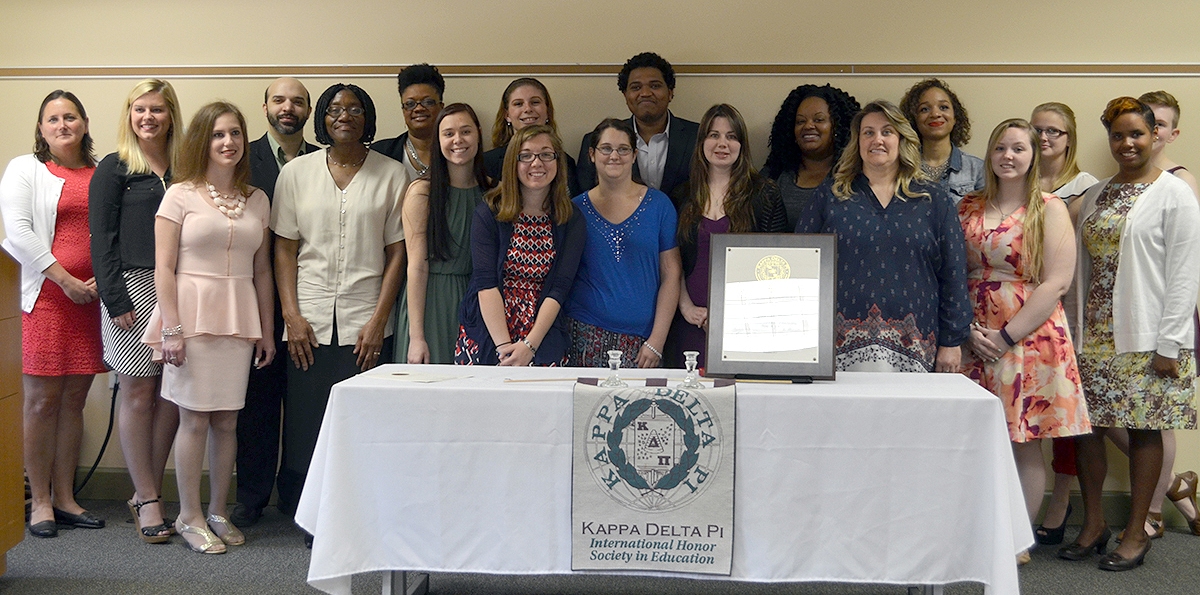 Chapter Counselor, and new inductee, Professor Elizabeth B. Settle, teacher education program coordinator at CSM, left, joins the 19 College of Southern Maryland inductees into the Kappa Delta Pi International Honor Society in Education, including from left, Casey Miller of Mechanicsville, Lisa Leyton of Lusby, Adam Brandao of Accokeek, Sandra Briscoe of Mechanicsville, Danielle Darden of Waldorf, Lauren Helms of Prince Frederick, Maria Estevez of La Plata (back), Krista Steele of Waldorf, Sara Browne of Lexington Park, Sidi Chleuh of Great Mills, Jenny Brewer of Huntingtown, J'Trenee Bryant of Waldorf, Lesley Windholz of Waldorf, Joelle Bush of Waldorf, Morgan Tickle of Mechanicsville, Rebecca Butner of St. Leonard, Raven Smoot of Marbury and Danielle Amster of Prince Frederick.