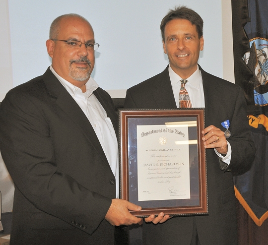 DAHLGREN, Va. (Aug. 10, 2017) - Naval Surface Warfare Center Dahlgren Division (NSWCDD) Technical Director John Fiore presents the Navy Superior Civilian Service Medal certificate to David Richardson, NSWCDD future combat systems engineer, at a ceremony held at the command's leadership forum. Richardson was honored for his, "numerous contributions to Navy programs and products through his remarkable management abilities, innovative thinking, and outstanding leadership."