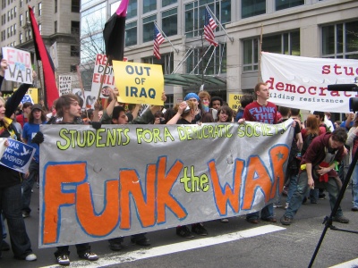Students march through downtown Washington, D.C., with a booming sound system as part of a protest called "Funk the War." (Photo: Ben Meyerson, Capital News Service)