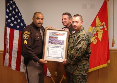 Pictured with Charles County Sheriff Rex Coffey (center) and Sgt. Proctor (left) is Gunnery Sergeant Roderuck Shriver. (Submitted photo)