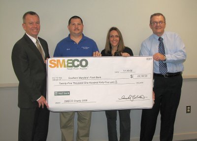 Pictured from left are Austin J. Slater, Jr., SMECO President and Chief Executive Officer; George Mattingly, Southern Maryland Food Bank assistant manager; Brenda DiCarlo, Food Bank program manager; and Larry Hak, SMECO Supply Chain Director and the director of the Co-op's Charity Golf Tournament. (Submitted photo)