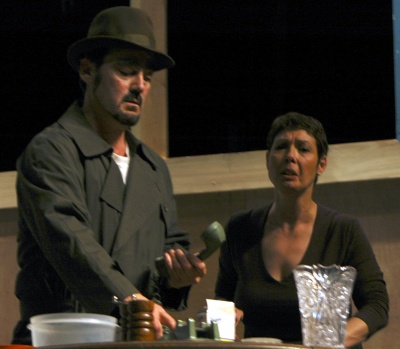Richard Taylor, left, terrorizes Sherry Santana, right, in the CSM Theatre Company production of “Wait Until Dark.” Taylor, of Waldorf, plays Mike, one of three crooks searching for drugs hidden in the apartment of blind housewife Susy Hendrix. Sherry Santana, of Waldorf, plays Susy, who must outwit the three thugs to stay alive. (Submitted photo)