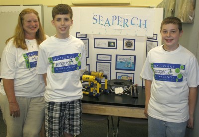 Piccowaxen Middle School students Travis Earnshaw, second from left, and Austin Boarman, right, competed at the National SeaPerch Challenge on May 23-25. Their team, the “Aquanauts,” won sixth place overall at the middle school level. Their team also won first place in the obstacle course challenge, and third place in the simulated oil challenge. The team is pictured with their sponsor, Teresa Jones, left, a gifted education teacher at Piccowaxen. (Submitted photo)