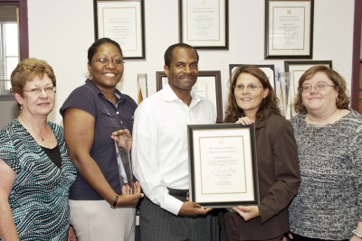 Employees from the College of Southern Maryland Human Resources Department display the Workplace Excellence Award and the Wellness Trailblazers Award they received from the Alliance for Workplace Excellence. From left are, Employee Benefits Coordinator Susan Needham, Assistant Director Employment and Employee Relations Tonia Miles-Carvana, Payroll Coordinator Darrel Bob, Payroll Department Director Patricia Zych and Director Compensation and Benefits Jennifer Rupp. (Submitted photo)