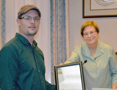 William Kreamer of Chesapeake’s Bounty in St. Leonard accepts the Green Grocer of the Year Award from Commissioner Susan Shaw