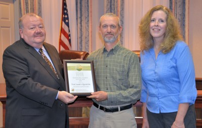 Jim and Patty Bourne of The Lamb’s Quarter accept the Sustainable Farmer of the Year Award from Commissioner Jerry Clark.