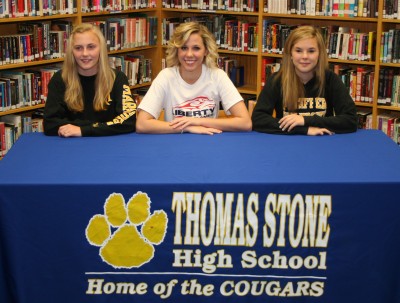 Thomas Stone High School seniors, from left, Ella Callahan, Alexis Albert and Emily (Gracie) Herbert, sign college National Letters of Intent.