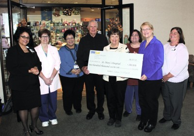 Hospital staff and members of the St. Mary's Hospital Auxiliary celebrate the Auxiliary's $200,000 donation of equipment and supplies to the hospital. The donation will be of benefit to many patients and their families and friends. (Submitted photo)