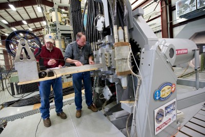 Gary Bass, left, and Jim Poyner, from the Naval Surface Warfare Center, Dahlgren Division, take measurements after a successful test firing of the Office of Naval Research-funded electromagnetic railgun prototype launcher. (U.S. Navy photo by John F. Williams/Released)