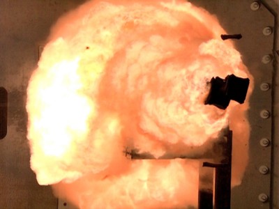 A high-speed camera captures the first full-energy shots from the Office of Naval Research-funded electromagnetic railgun prototype launcher that was recently installed at a test facility in Dahlgren, Va. The test shots begin a month-long series of full-energy tests to evaluate the first of two industry-built launchers that will help bring the Navy a step closer to producing a next-generation, long-range weapon for surface ships. The new launcher brings advanced material and high-power technologies in a system that now resembles a large-caliber gun. (U.S. Navy photo/Released)