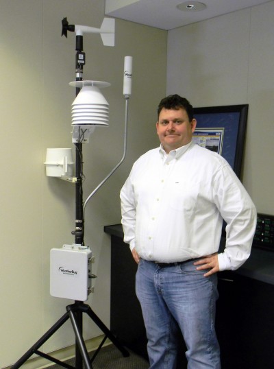Director of Business Development Dave Oberholzer stands in front of Earth Network's WeatherBug weather system at the company's Germantown headquarters. (Photo: Varun Saxena)