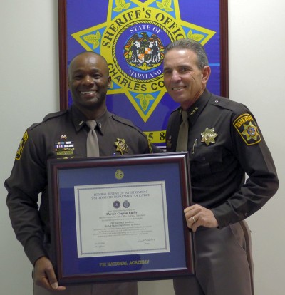 Lieutenant Marvin Butler (left) and Sheriff Rex W. Coffey.
