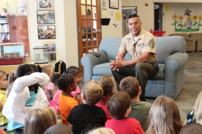 CSM elementary education student Vincent Juarez, who retired from the Marine Corps in 2009, was the Celebrity Reader at the St. Charles Children’s Learning Center on the La Plata Campus of the College of Southern Maryland May 23. Juarez drew on his teacher education training as he patiently listened as the talkative 3- to 5-year-olds shared with him their favorite colors, the favorite colors of their parents, best friends—and even their pets—as he read “Percival the Plain Little Caterpillar,” by Helen Brawley.