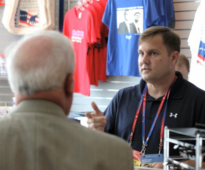 Brian Harlin (right), 45, owner of the Glen Burnie-based GOP Shoppe, assists a customer at the Tampa Bay Times Forum in Tampa, Fla. Harlin is the official campaign merchandise vendor of the 2012 Republican National Convention. (Photo: Carl Straumsheim)