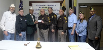 Mr. Robert M. Johnson and members of the American Legion present Sgt. Carl Rye, Sheriff Rex Coffey and Sgt. Mike Vaughn with a donation to support the D.A.R.E. program.