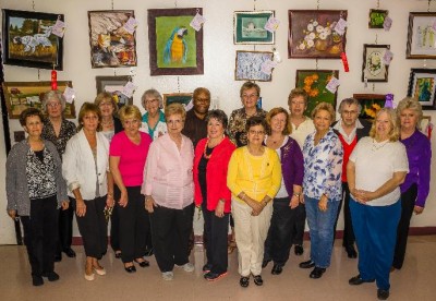 Winners of the 2013 Senior Arts Competition pose for a picture in front of a wall display of their artwork on May 8 at the Richard R. Clark Senior Center in La Plata. (Photo courtesy Charles Co. Government)