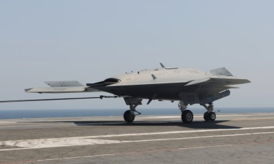 The X-47B lands aboard USS George H.W. Bush (CVN 77) July 10, marking the first time an unmanned aircraft has made an arrested landing on a modern aircraft carrier. (U.S. Navy photo)