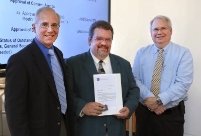 Zimmerman (center) stands with President of the U.S. National Committee of the International Electrotechnical Commission (IEC) Phil Piqueira (left) and Jim Matthews, Vice President IEC Central Office, during an award ceremony at the National Electrical Manufacturers Association. Zimmerman received the IEC's 1906 Award for his contributions to an international laser standards document helping establish international safety standards for laser manufacturing. (U.S. Navy photo by Elliott Fabrizio/Released)