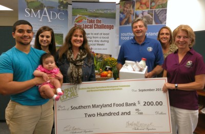 Left to right: Ricky Echeona, son-in-law and Layla, grandaughter (baby); Emma Echeona, daughter; Desiree St. Clair Glass – BLC Contest Winner; Buddy Hance – Maryland Agriculture Secretary; Brenda Di Carlo – Director, Southern Maryland Food Bank; Christine Bergmark – Executive Director, SMADC. (Submitted photo)