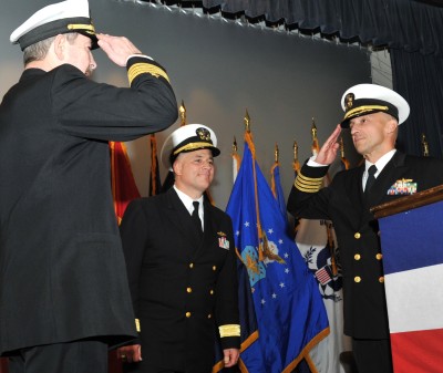 Rear Adm. Lawrence Creevy, center, commander of Naval Surface Warfare Center (NSWC), watches as Capt. Brian Durant, right, relieves Capt. Michael Smith as commander of NSWC Dahlgren Division, during a change of command ceremony at NSWC Dahlgren Division. (U.S. Navy photo/Released)