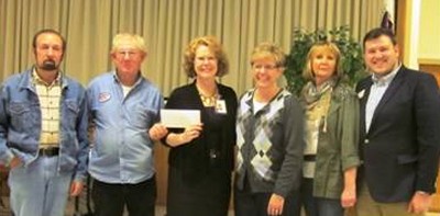 Linda Gottfried, Director of Development accepts contribution from Roger Hamilton, President of the Tri-County Cruisers and additional members of the club. (Submitted photo)