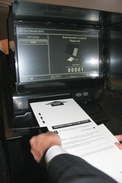 A paper ballot inside a privacy shield is scanned for counting. (Photo: MarylandReporter.com)