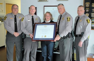 Pictured are Lt. Craig Bowen, Lt. Bill Soper, Debra Nevin, Office Aide, Sheriff Mike Evans, and Major Dave McDowell displaying their CALEA re-accreditation award.