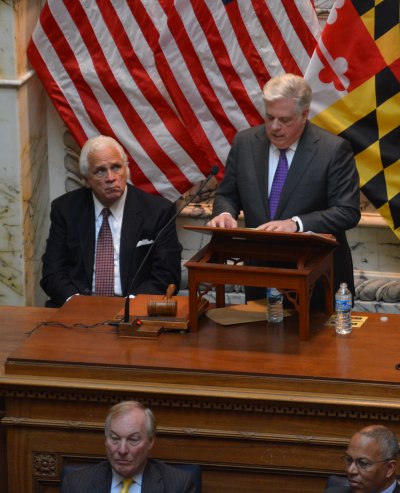 Governor Larry Hogan, standing, addresses the General Assembly on Wednesday, February 4, while Senate President Thomas V. "Mike" Miller Jr., left, looks on. (Photo: Anjali Shastry)