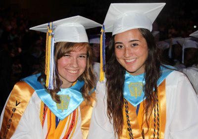 Henry E. Lackey High School valedictorian Melissa Nelson, left, and salutatorian Jessica Nichols, right, prepare to give their farewell speeches to their classmates during the Lackey graduation ceremony held May 30 in the Convocation Center at North Point High School. Lackey seniors received more than $7 million in scholarship offers.