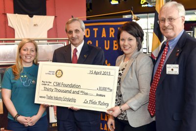 Immediate Past President Jamie Reidy, left, presents a ceremonial check for $30,000 to be paid over 10 years from the La Plata Rotary for trades scholarships to, from left, CSM President Dr. Brad Gottfried, Development Director Chelsea Brown and CSM Foundation Director and La Plata Rotary member Greg Cockerham. (Submitted photo)