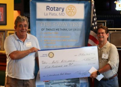 CCAA President Robert Rausch, left, receives the check from La Plata Rotary Club President Jim Cook.