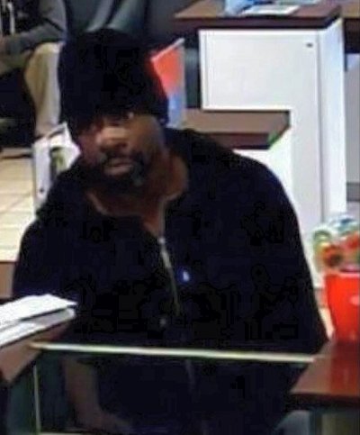 A photograph of the robbery suspect.