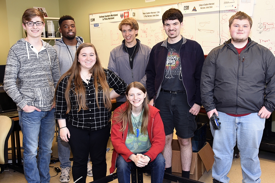 Members of the CSM collegiate robotics team, the Talons, including, from left, Bradley Evans of California, Kevin Jackson of Lusby, Allison Decarlo of Charlotte Hall, Zoe Lambert of Hollywood (seated), Chad Baker of Mechanicsville, John Hamel of Mechanicsville and George Jenkins of La Plata, are looking forward to the Feb. 5 VEX U World Championship qualifying competition on their campus.