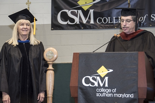 CSM Faculty Senate President Professor Mike Green, right, announces the 2016 Faculty Excellence Award Honoring Adjunct Faculty to Dr. Margaret Dowell, left.