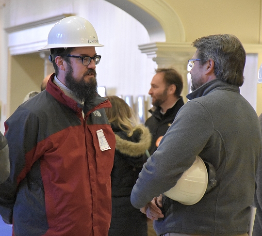 Solar workers Tim Gillen, left, and Harry Benson arrive in Annapolis on Thursday, February 11, to show support for pending legislation that would require electric companies to reduce the time it takes to connect customers' energy panels to their power grids. (Photo: Leo Traub)