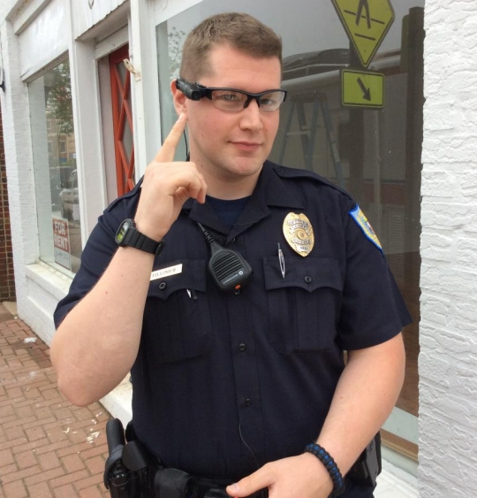 A city of Laurel, Md. police officer points to his head-mounted digital camera. (Photo: City of Laurel)
