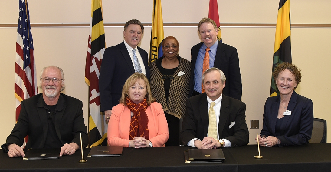 Representatives participating in the Virginia Tech and CSM articulation agreement signing ceremony March 30 were, seated from left, Virginia Tech Myers-Lawson School of Construction Building Construction Department Head Yvan J. Beliveau, Virginia Tech Vice Provost for Enrollment and Degree Management Wanda Hankins Dean, CSM President Dr. Brad Gottfried and CSM Vice President of Academic Affairs Dr. Eileen Abel, and standing from left, Maryland Higher Education Commission Secretary James C. Fielder Jr., CSM Trustee Dr. Janice Walthour and Chaney Enterprises CEO Francis "Frank" Chaney.