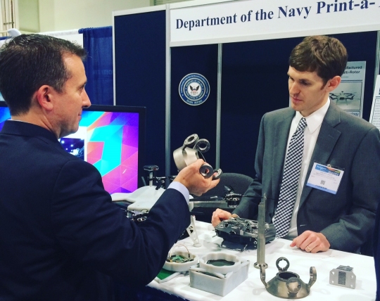 NATIONAL HARBOR, Md. (May 17, 2016)—Navy engineer Steve Price answers an attendee's question about the small additively manufactured modular payload multi-rotor at the 2016 Sea-Air-Space Expo. This low cost, 3D printed, unmanned aerial vehicle is rapidly adaptable to mission requirements and can accept a wide variety of custom payloads. The UAV was one of the exhibits featured at the Navy Additive Manufacturing Showcase in Dahlgren, Va., last month that were selected for display at the Sea-Air-Space Expo. "The volume of creative and innovative ideas made feasible with 3D Printing is astounding," said Lynn Shoppell, a Naval Surface Warfare Center Dahlgren Division physicist after the Dahlgren showcase. "The exhibitors demonstrated that their concepts for increased technical capabilities, rapid prototyping, improved logistics operations, and cost reduction initiatives are achievable with 3D Printing. Participants also experimented with additive manufacturing technology research and development." (U.S. Navy photo/released)